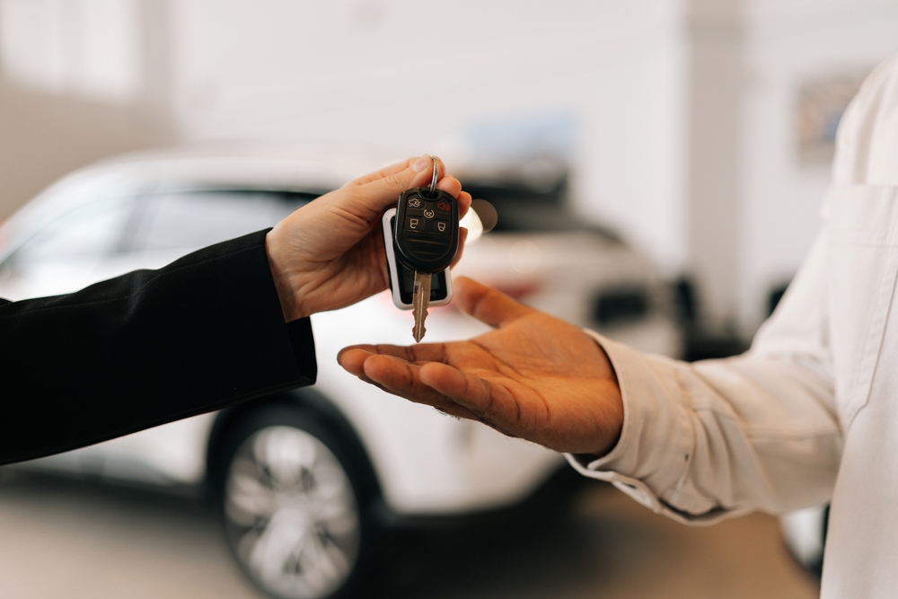 Closeup,Hand,Of,Unrecognizable,Black,Male,Buyer,Getting,Car,Key